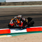 Racing motorcycle on a track with 'WeatherTech' branding in the background